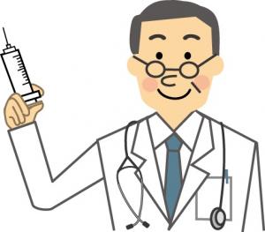 注射器を持つ医師